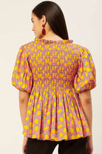 Smocked peplum top