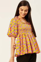 Smocked peplum top