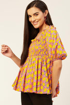Smocked peplum top