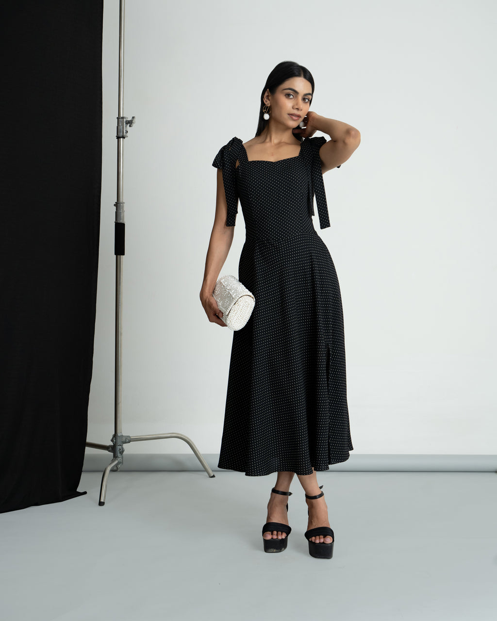 Black polka shoulder knot style dress