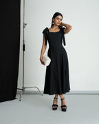 Black polka shoulder knot style dress