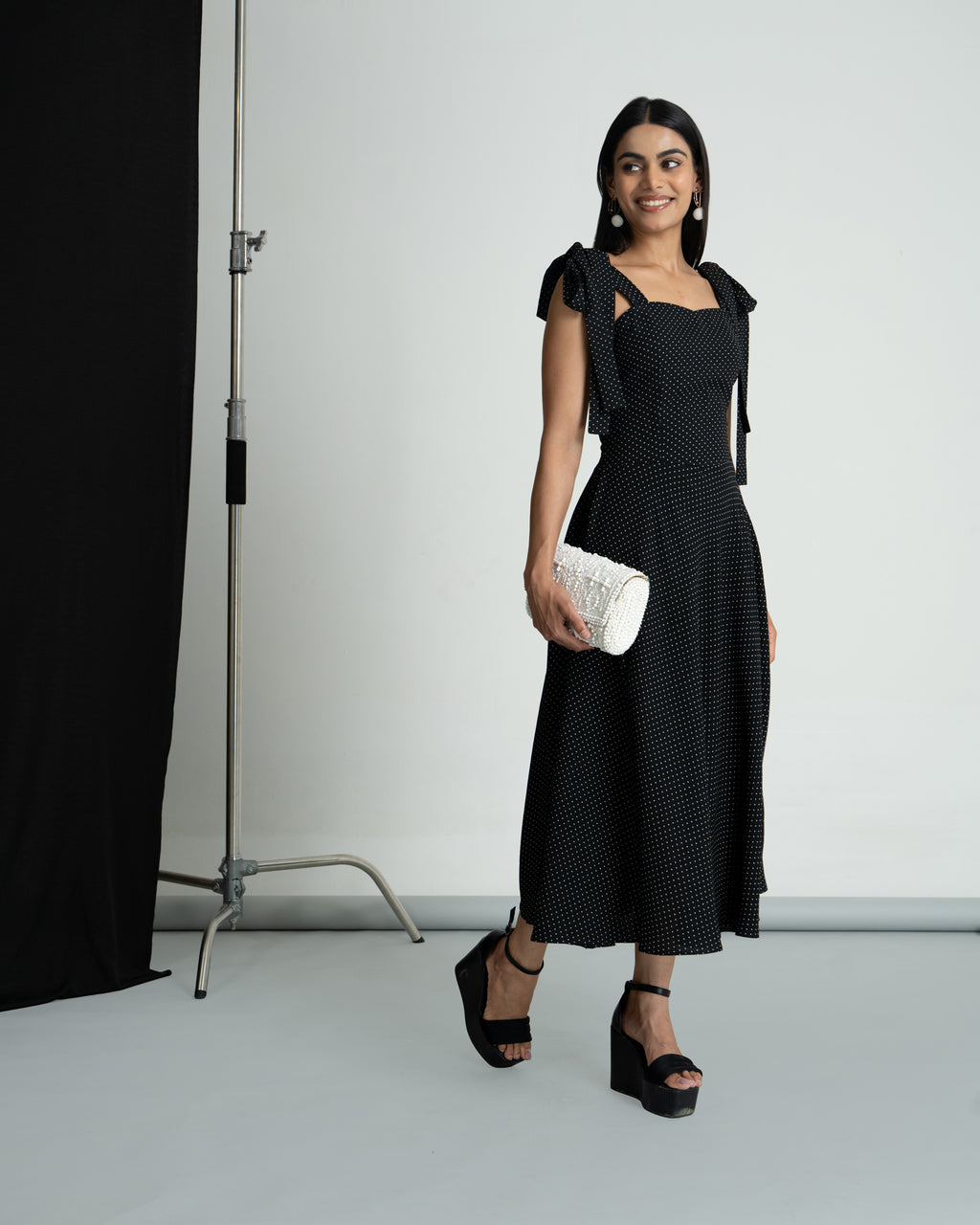 Black polka shoulder knot style dress