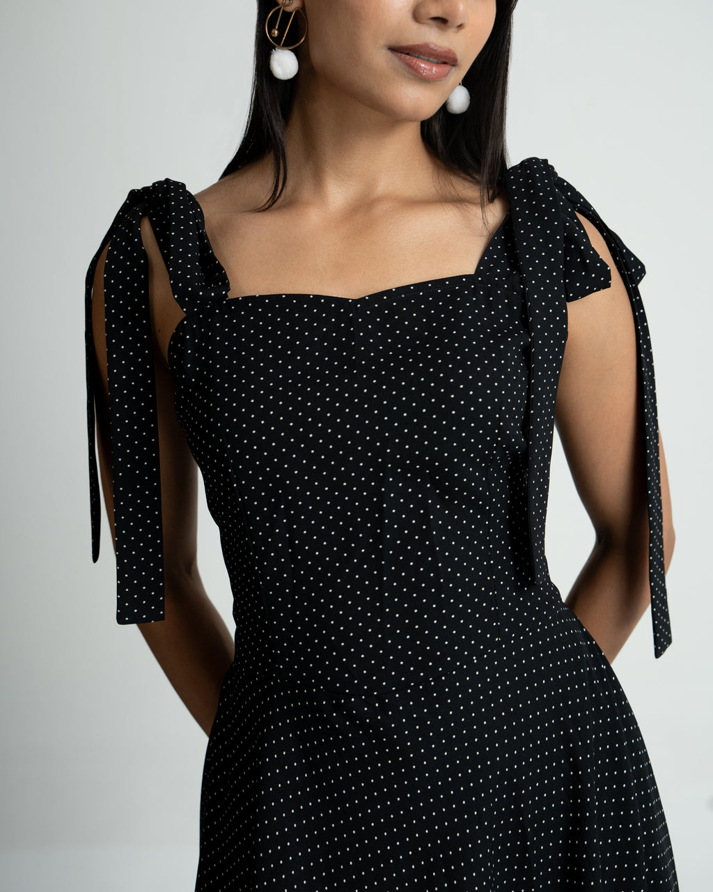 Black polka shoulder knot style dress