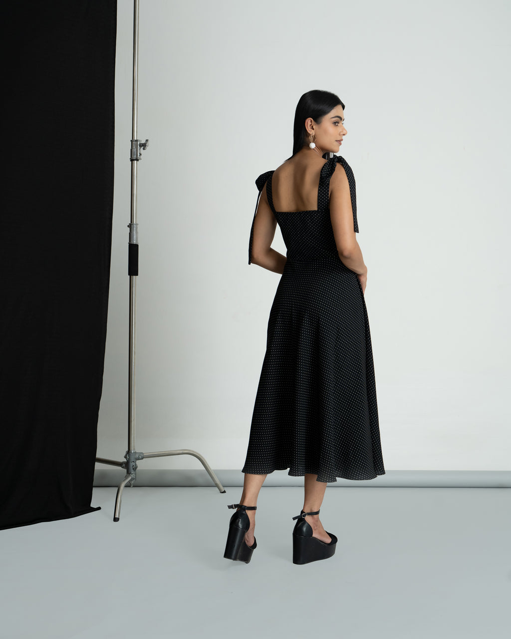 Black polka shoulder knot style dress